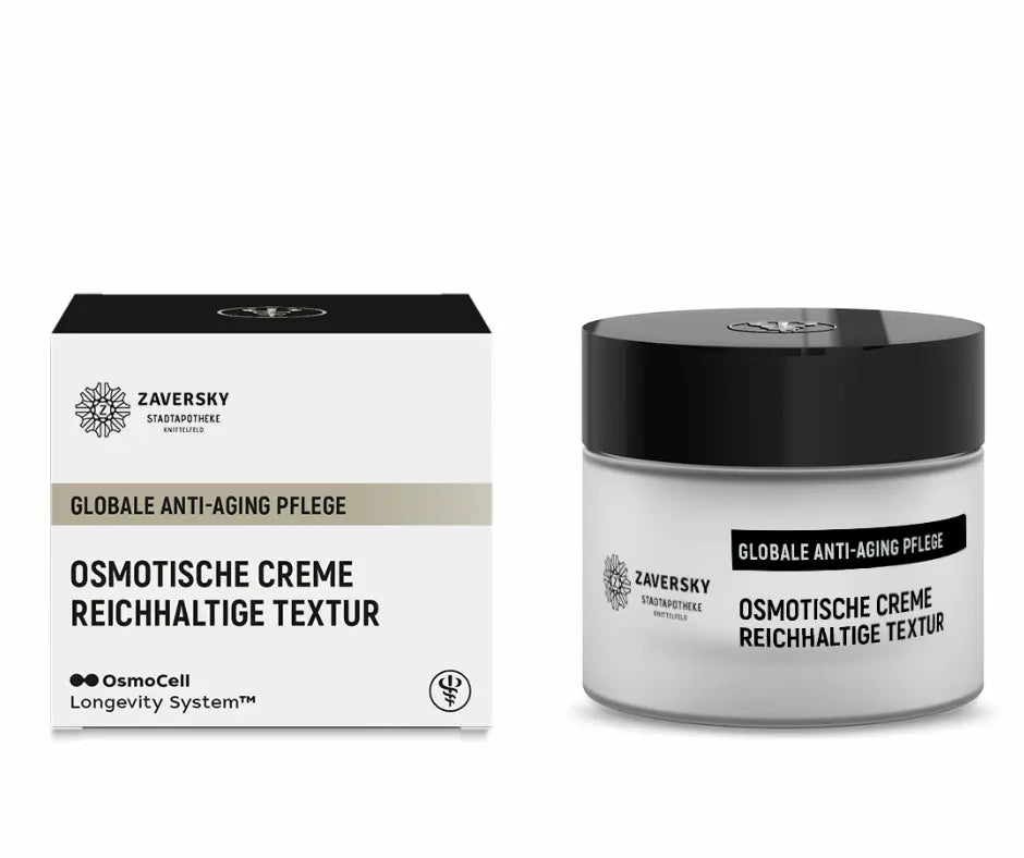 Zaversky Stadtapotheke Osmotische Creme reichhaltige Textur, weißer Tiegel mit schwarzem Deckel neben Faltschachtel, globale Anti-Aging Pflege