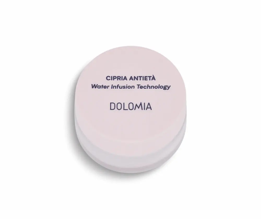 Runde rosafarbene Puderdose Dolomia Cipria Antietà mit Water Infusion Technology, geschlossen in Draufsicht.