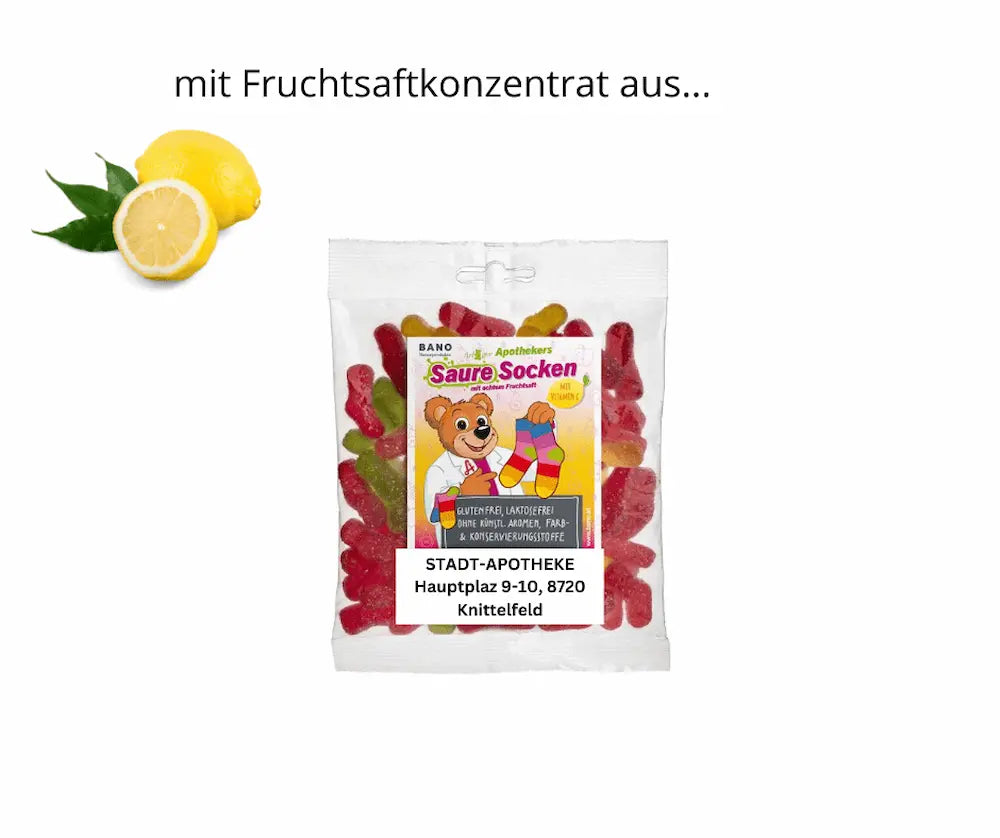 BANO Saure Socken Fruchtgummi im Beutel mit Vitamin C, glutenfrei und laktosefrei, daneben frische Zitrone