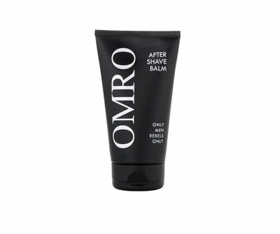 OMRO After Shave Balm in schwarzer Tube mit weißer Beschriftung und Aufdruck „Only Men Rebels Only“, Vorderansicht.