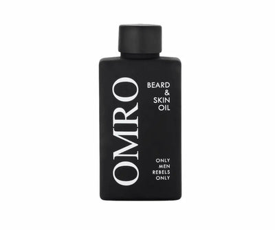 OMRO Beard & Skin Oil in schwarzer, rechteckiger Flasche mit schwarzem Deckel und weißer Aufschrift „Only Men Rebels Only“, Vorderansicht.