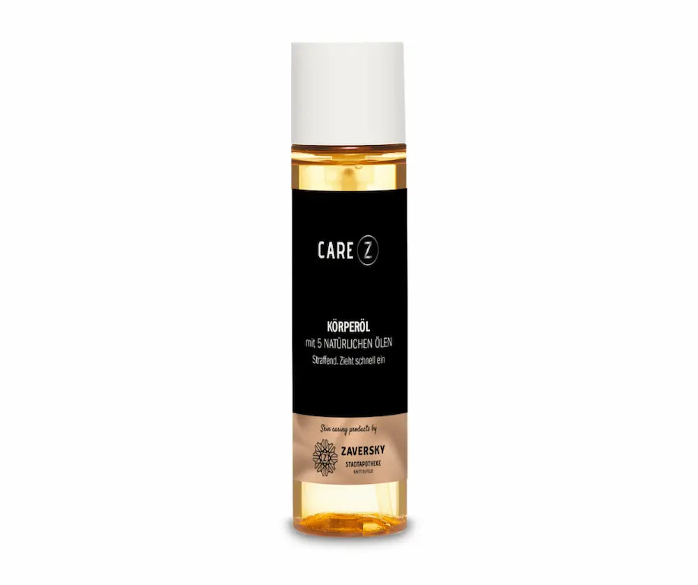CARE Z Körperöl mit 5 natürlichen Ölen, transparente Flasche mit goldenem Öl, schwarzem Etikett und weißem Verschluss