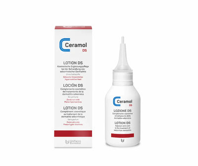Ceramol DS Lotion in weißer Flasche mit Applikatorspitze neben weiß-roter Faltschachtel, Vorderansicht