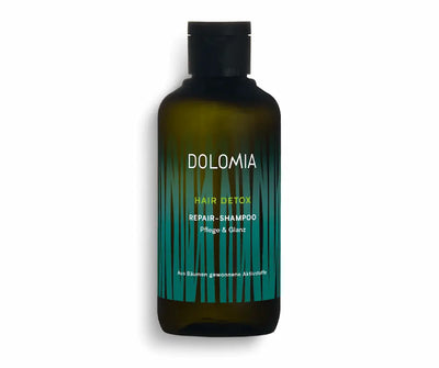 Dolomia Hair Detox Repair-Shampoo für Pflege und Glanz in grüner Flasche mit dekorativem Grasmuster, Vorderansicht